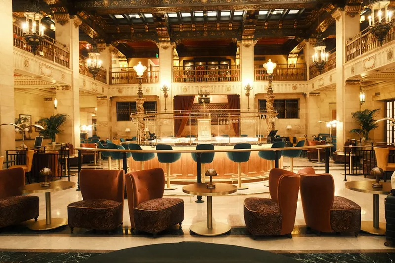 A large lobby with a lot of chairs and tables